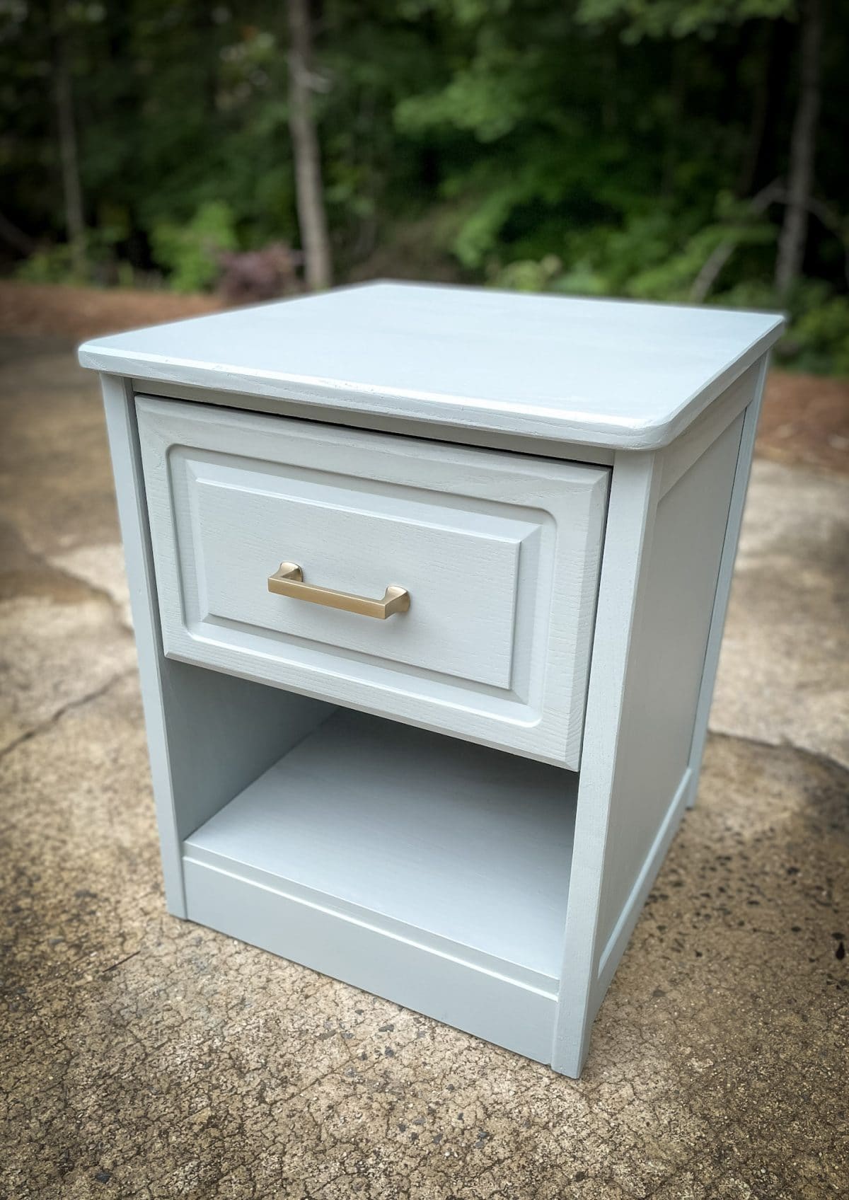 finished nightstand sitting outside