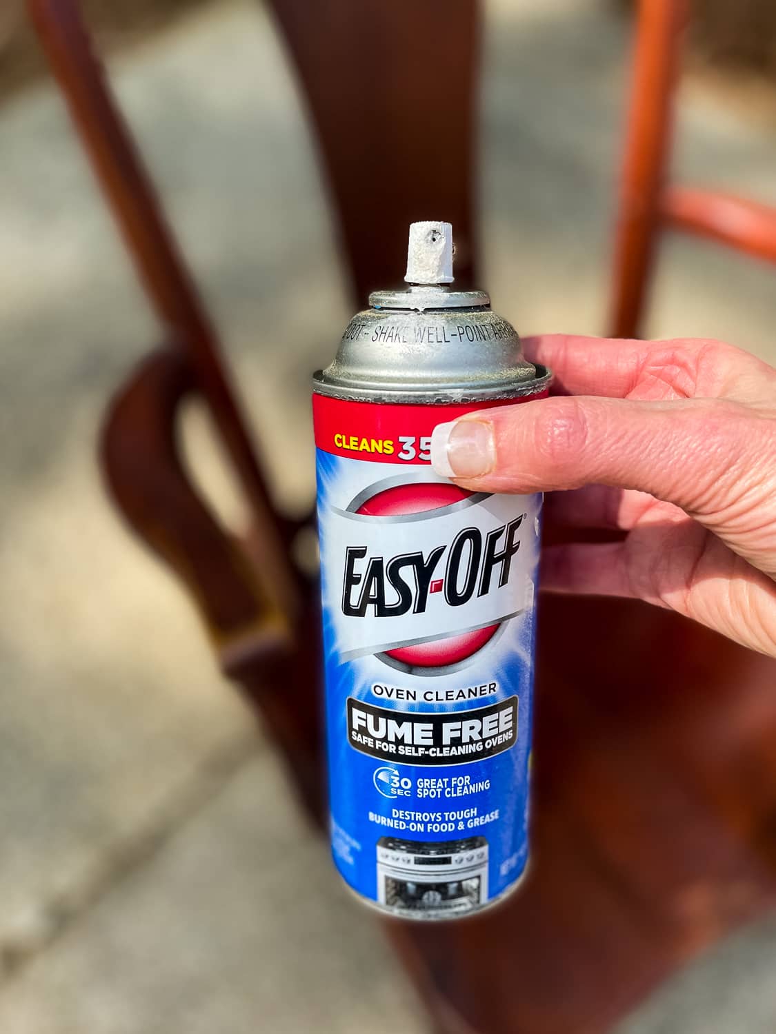 can of easy off oven cleaner in front of furniture
