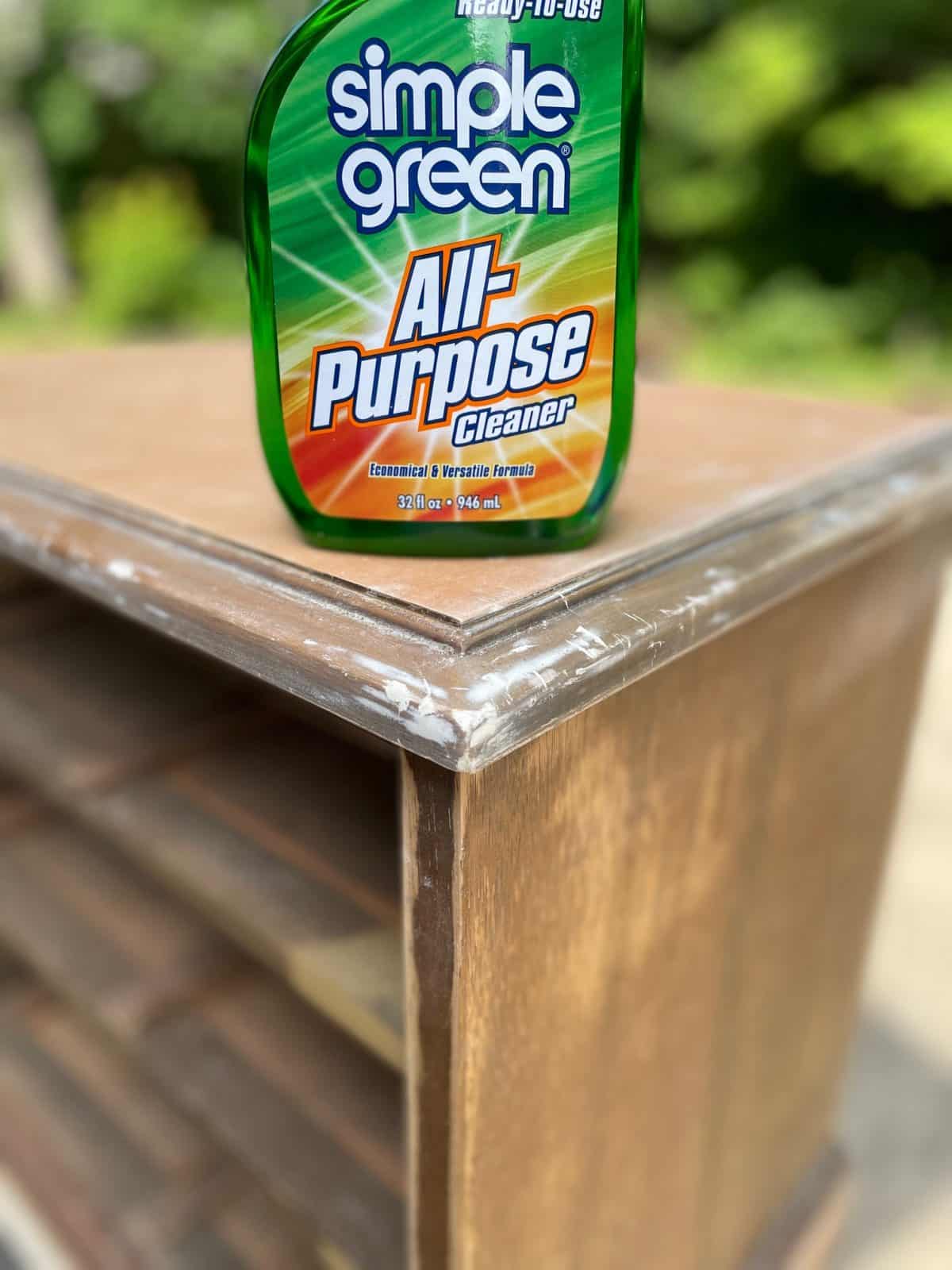 Simple Green All-Purpose Cleaner sitting on top of unfinished nightstand