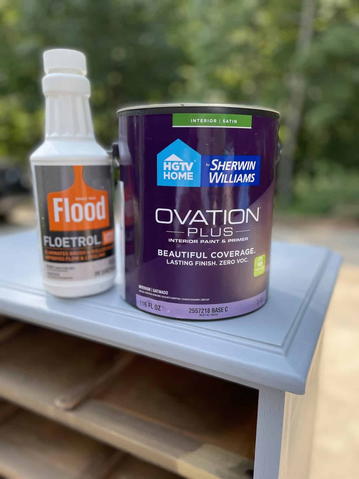 Ovation Paint and Floetrol sitting on top of bedside table